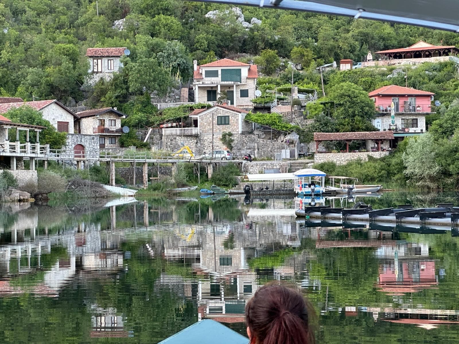 Karuc fishing village reflected in Lake Skadar, Montenegro